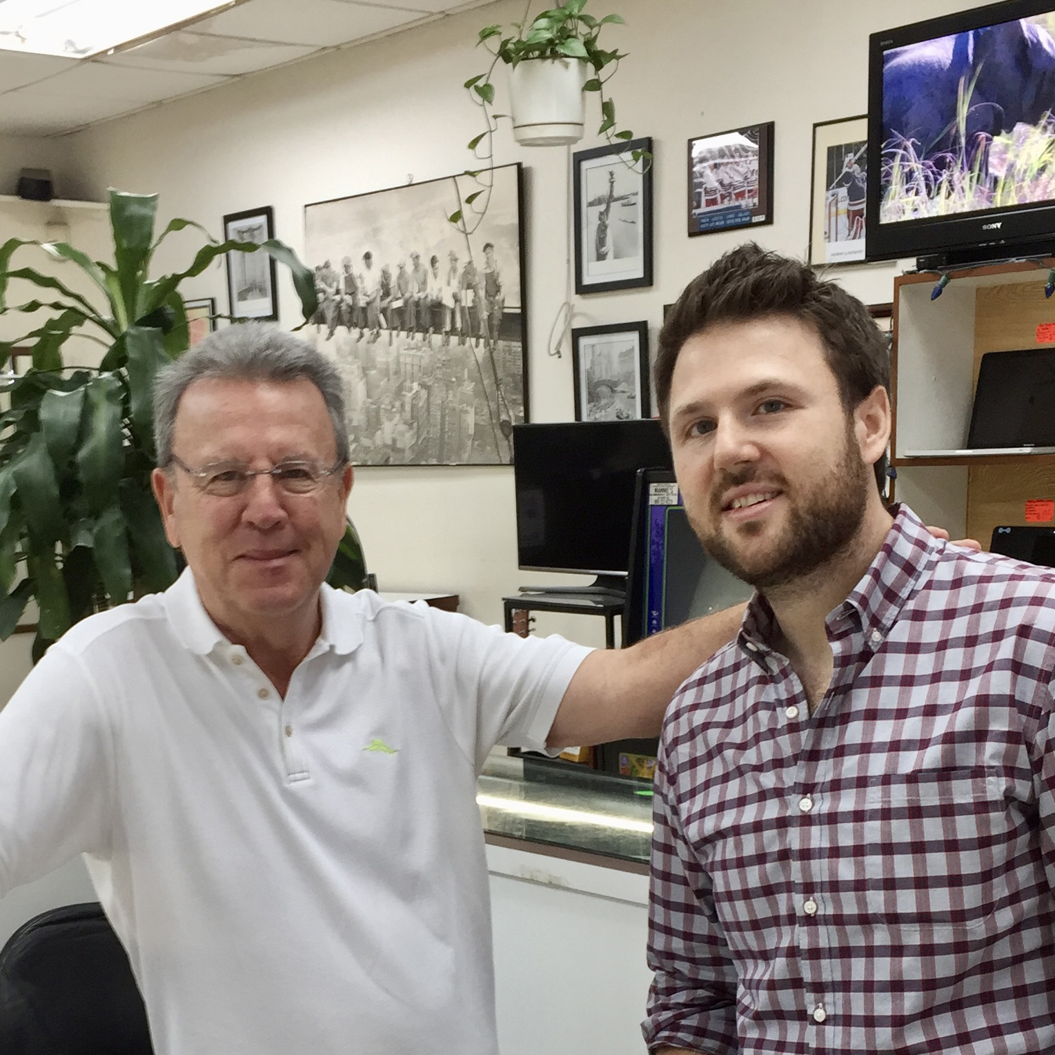 Color photo of Daniel Kalter and his father inside Lincoln Square Pawnbrokers